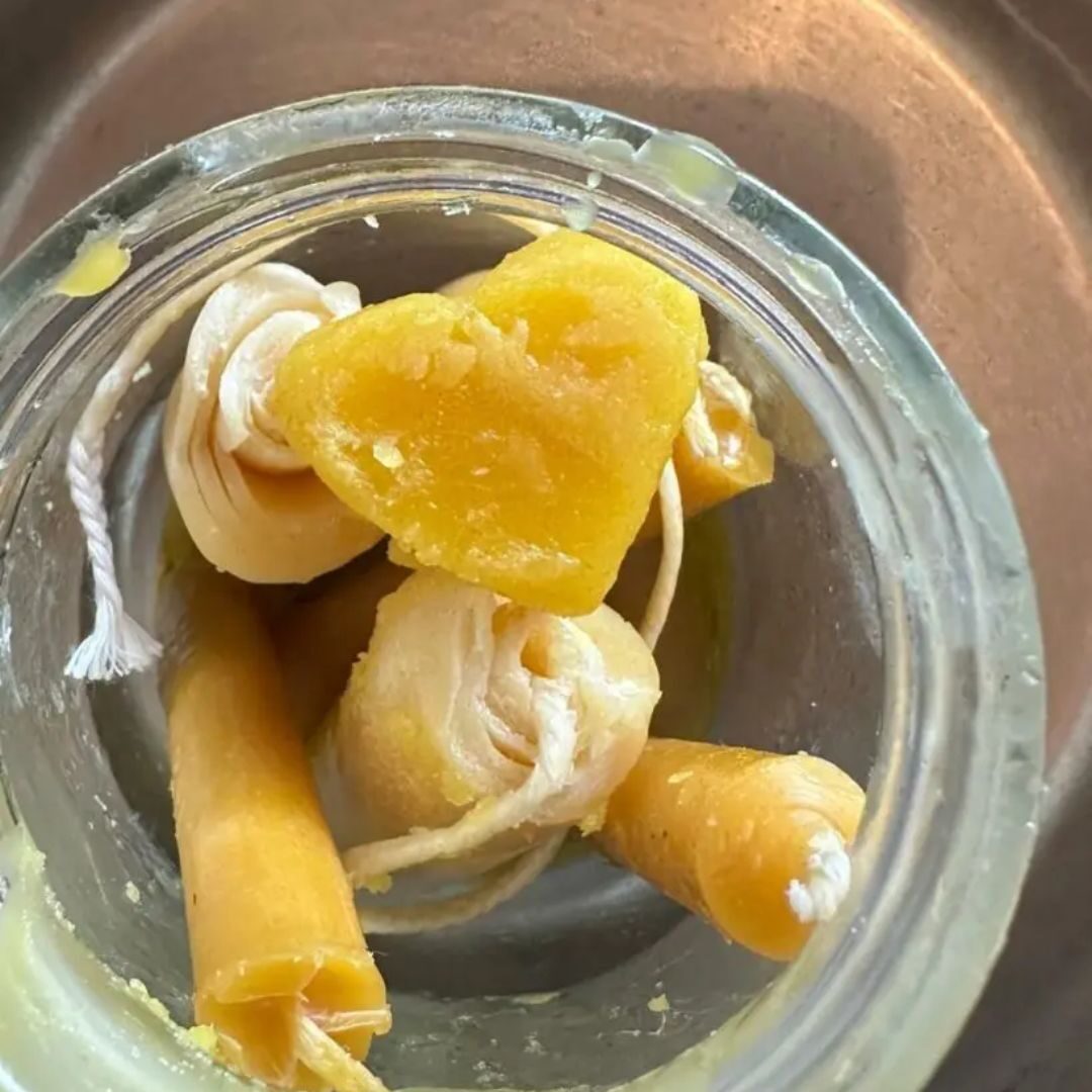 The melt going clear as the beeswax goes in